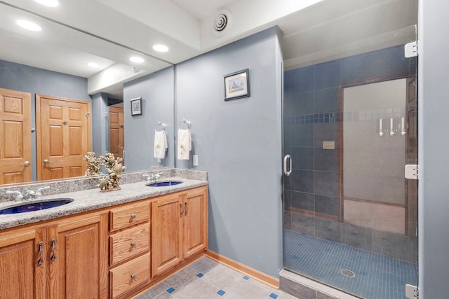 400 Rock Creek Dr, Manteno, IL 60950 - bathroom featuring a sink, tile patterned floors, a stall shower, and recessed lighting