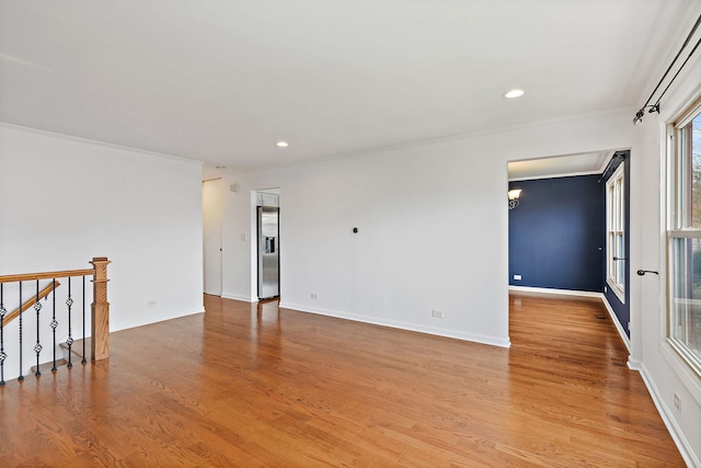 705 Old Mill Grove Rd, Lake Zurich, IL 60047 - spare room with crown molding, recessed lighting, baseboards, and wood finished floors