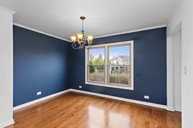 705 Old Mill Grove Rd, Lake Zurich, IL 60047 - unfurnished room featuring crown molding, baseboards, a notable chandelier, and wood finished floors