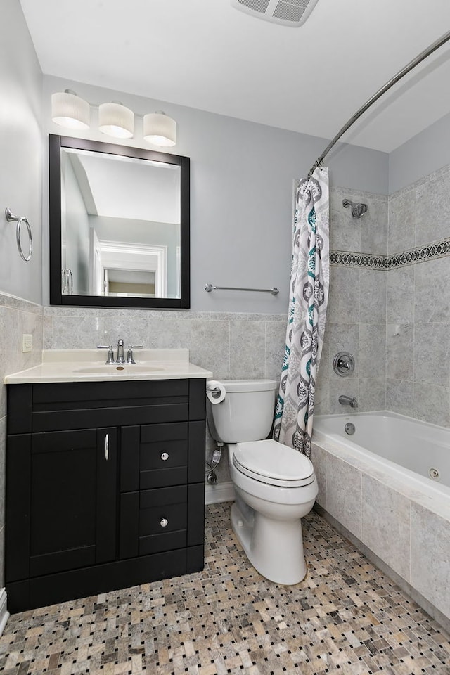 705 Old Mill Grove Rd, Lake Zurich, IL 60047 - bathroom with wainscoting, toilet, tile walls, tiled shower / bath combo, and visible vents