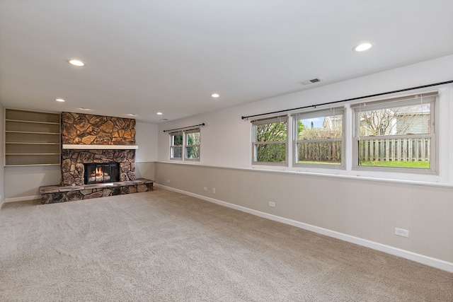 705 Old Mill Grove Rd, Lake Zurich, IL 60047 - unfurnished living room featuring a stone fireplace, visible vents, baseboards, carpet, and recessed lighting