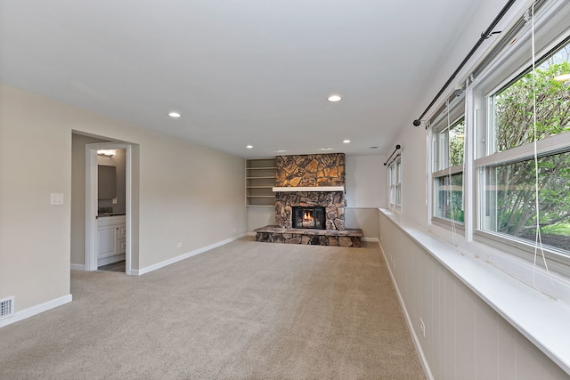 705 Old Mill Grove Rd, Lake Zurich, IL 60047 - unfurnished living room with visible vents, a stone fireplace, baseboards, recessed lighting, and carpet
