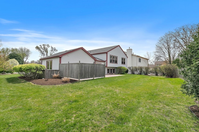 705 Old Mill Grove Rd, Lake Zurich, IL 60047 - rear view of house with a lawn, fence, and a chimney
