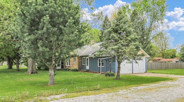 obstructed view of property with a chimney, fence, driveway, and a front yard