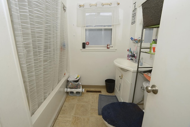 bathroom with vanity, visible vents, shower / bath combination with curtain, baseboards, and tile patterned floors