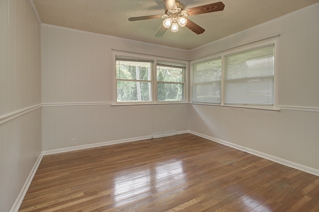 14521 S Naperville Rd, Plainfield, IL 60544 - unfurnished room with crown molding, wood-type flooring, ceiling fan, and baseboards