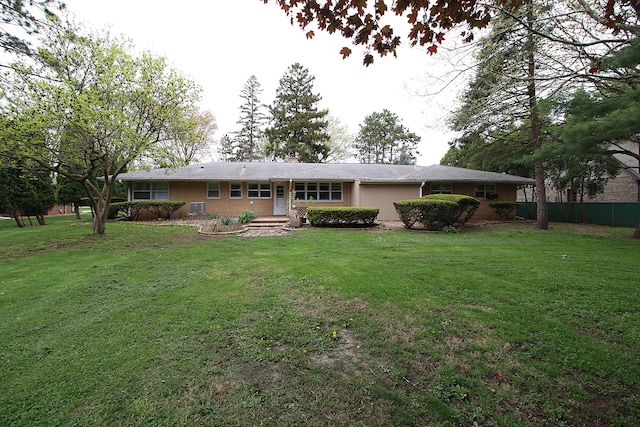 back of property with a lawn, fence, and a chimney