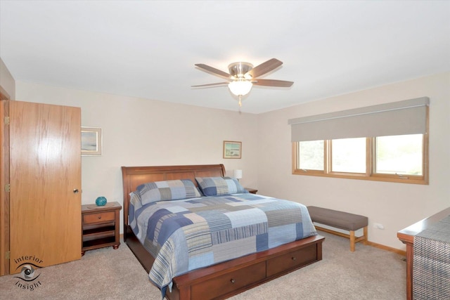 bedroom with carpet, baseboards, and a ceiling fan
