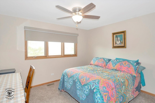 bedroom with carpet floors, baseboards, and a ceiling fan