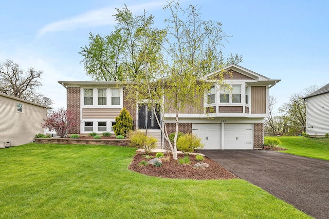 629 Sheffield Ln, Bolingbrook, IL 60440 - split foyer home with brick siding, an attached garage, driveway, and a front yard