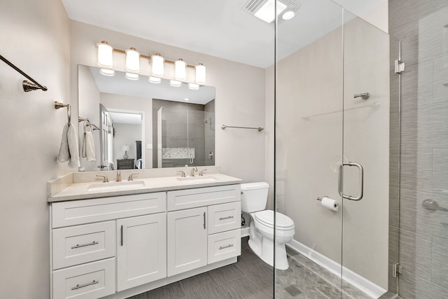 629 Sheffield Ln, Bolingbrook, IL 60440 - ensuite bathroom featuring double vanity, toilet, a shower stall, and a sink