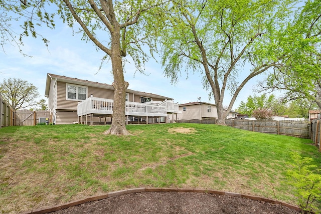 629 Sheffield Ln, Bolingbrook, IL 60440 - view of yard featuring a fenced backyard, a wooden deck, and cooling unit