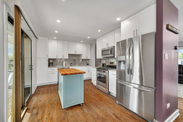 629 Sheffield Ln, Bolingbrook, IL 60440 - kitchen featuring backsplash, dark wood-style flooring, appliances with stainless steel finishes, a sink, and butcher block counters