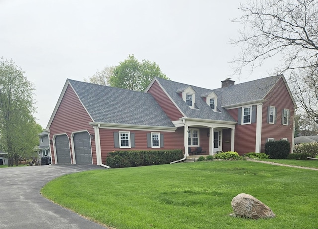 726 Parkside Dr, Sycamore, IL 60178 - view of front of home with asphalt driveway, a chimney, roof with shingles, and a front lawn
