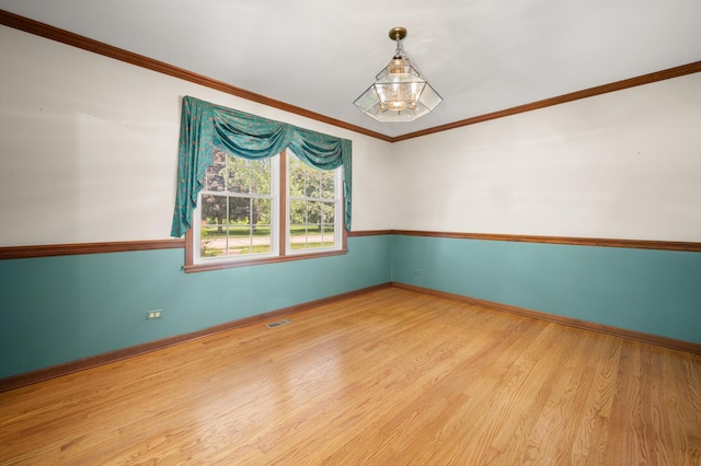 726 Parkside Dr, Sycamore, IL 60178 - empty room with baseboards, wood finished floors, and ornamental molding
