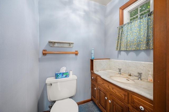 726 Parkside Dr, Sycamore, IL 60178 - bathroom featuring vanity, toilet, and baseboards