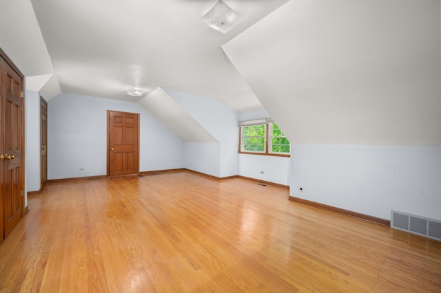 726 Parkside Dr, Sycamore, IL 60178 - bonus room with lofted ceiling, light wood-type flooring, and baseboards