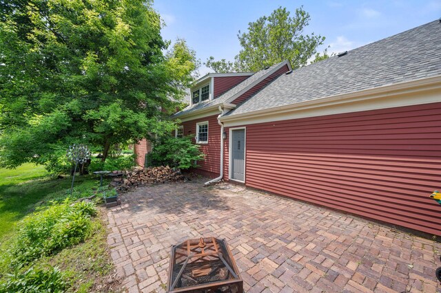 726 Parkside Dr, Sycamore, IL 60178 - view of patio featuring a fire pit