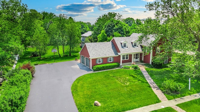 726 Parkside Dr, Sycamore, IL 60178 - cape cod home with asphalt driveway, a front lawn, and a garage