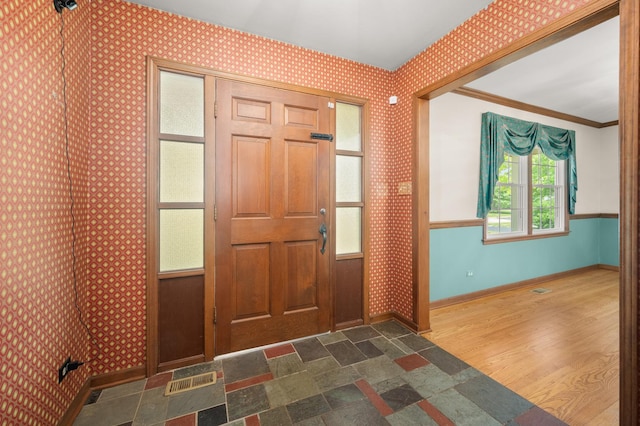 726 Parkside Dr, Sycamore, IL 60178 - foyer entrance with baseboards, crown molding, and wallpapered walls