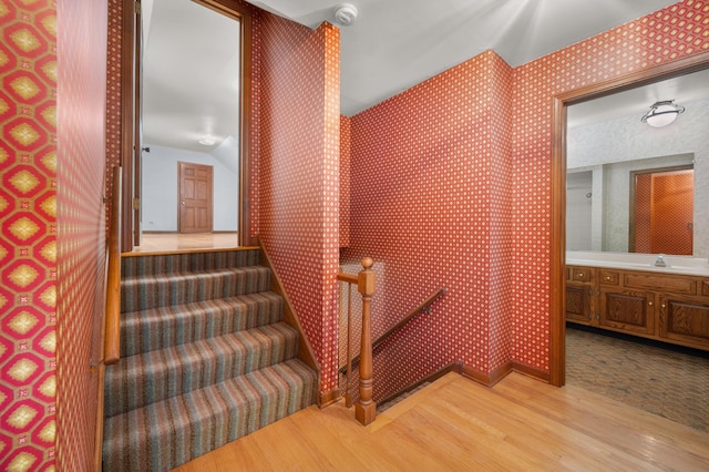726 Parkside Dr, Sycamore, IL 60178 - stairway featuring wood finished floors and wallpapered walls