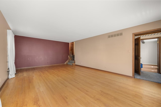 726 Parkside Dr, Sycamore, IL 60178 - unfurnished room with stairs, light wood-style flooring, and baseboards