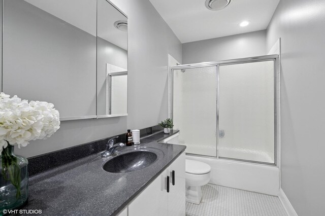 4000 Dundee Rd Unit 202C, Northbrook, IL 60062 - full bathroom with toilet, enclosed tub / shower combo, vanity, and tile patterned flooring