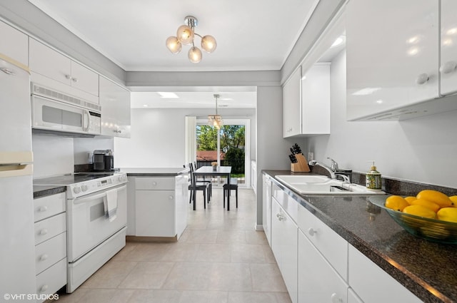 4000 Dundee Rd Unit 202C, Northbrook, IL 60062 - kitchen featuring white appliances, white cabinets, a sink, dark countertops, and light tile patterned floors