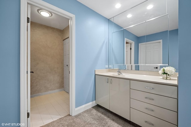 4000 Dundee Rd Unit 202C, Northbrook, IL 60062 - bathroom with vanity, baseboards, tile patterned floors, and recessed lighting