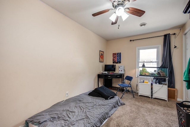bedroom with a ceiling fan and carpet flooring