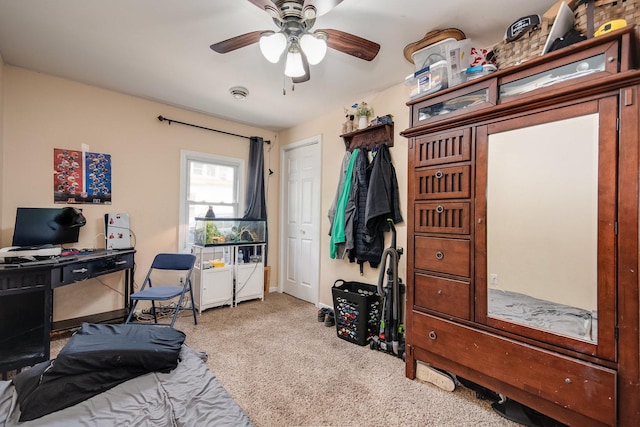 bedroom with baseboards, carpet flooring, and a ceiling fan