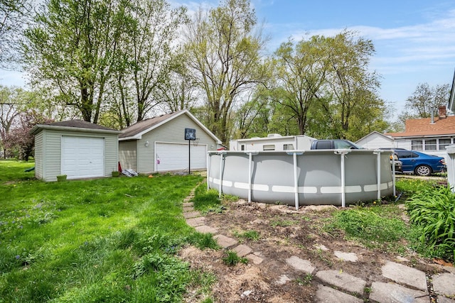 detached garage featuring an outdoor pool