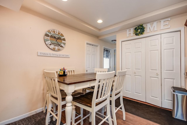 dining space with recessed lighting and baseboards