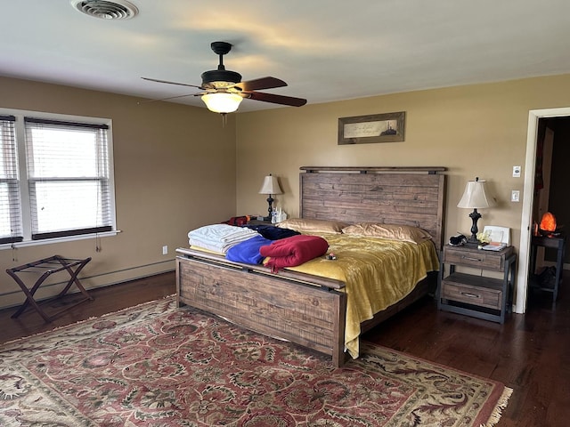436 E Seminary Ave, Onarga, IL 60955 - bedroom featuring wood finished floors, ceiling fan, and baseboards