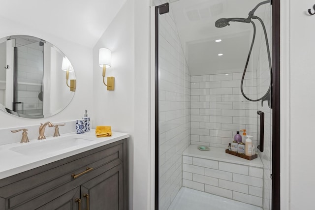 bathroom with vanity, visible vents, and a shower stall