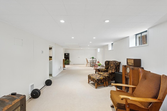 living area with carpet flooring, visible vents, and recessed lighting