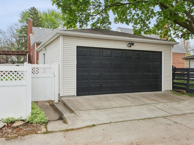 garage with fence