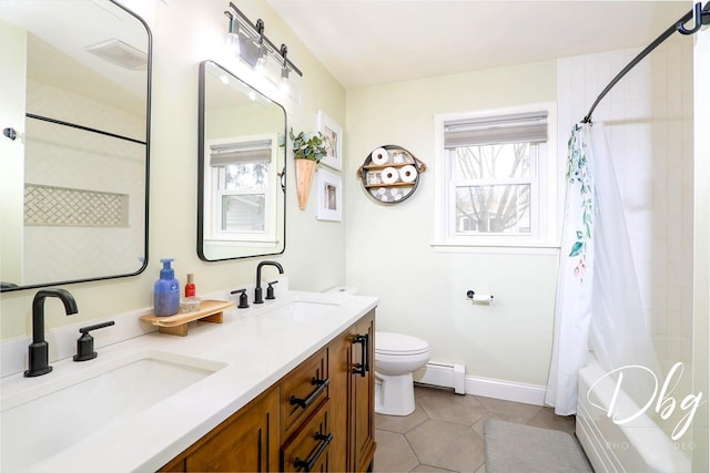 395 Magnolia Ave, Gurnee, IL 60031 - full bath featuring a sink, plenty of natural light, and baseboard heating