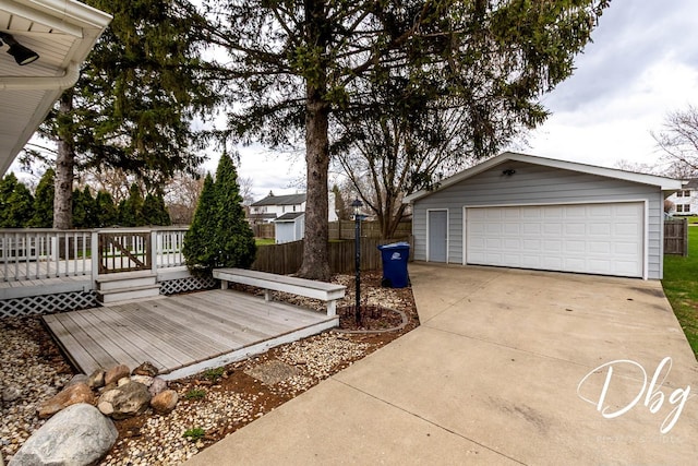 395 Magnolia Ave, Gurnee, IL 60031 - deck featuring a detached garage, fence, and an outdoor structure