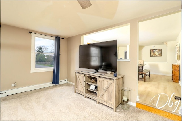 395 Magnolia Ave, Gurnee, IL 60031 - living room with baseboards, a ceiling fan, and a baseboard heating unit