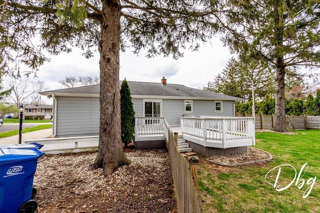 395 Magnolia Ave, Gurnee, IL 60031 - rear view of house with fence, a wooden deck, a chimney, and a yard