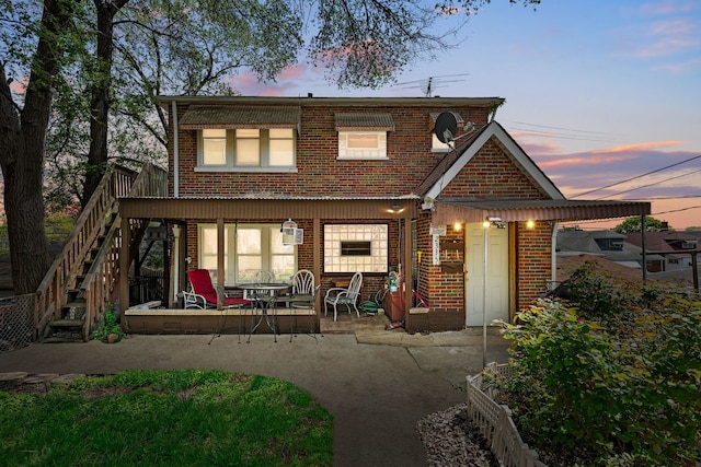 2335 N Merrimac Ave, Chicago, IL 60639 - back of house featuring brick siding, a patio area, and stairs