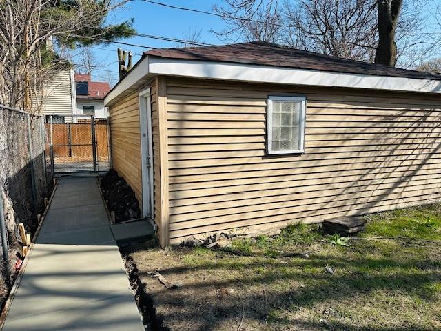 view of home's exterior featuring fence