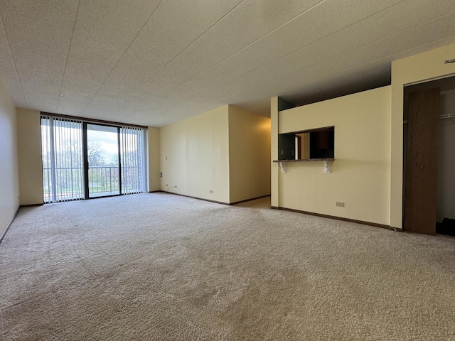 75 Kristin Cir Unit 221, Schaumburg, IL 60195 - bedroom with carpet floors, baseboards, and an AC wall unit