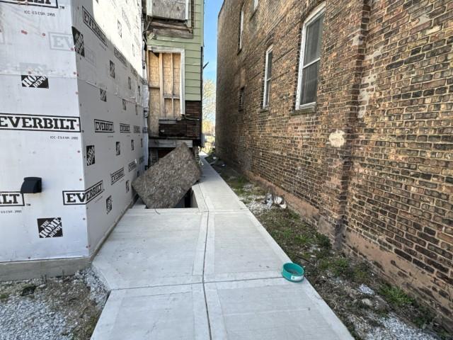 view of property exterior featuring brick siding