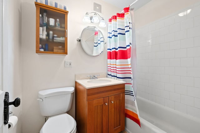 full bath featuring visible vents, shower / bath combo, toilet, and vanity