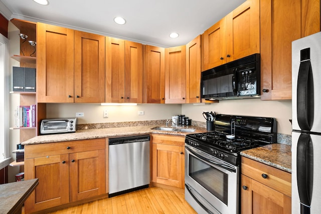 kitchen with open shelves, appliances with stainless steel finishes, a sink, recessed lighting, and a toaster