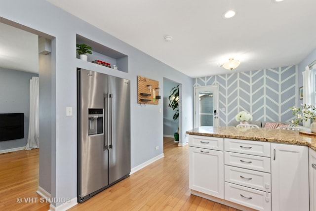 69 N Idlewild Ave, Mundelein, IL 60060 - kitchen with high quality fridge, white cabinets, light wood-style flooring, light stone countertops, and baseboards