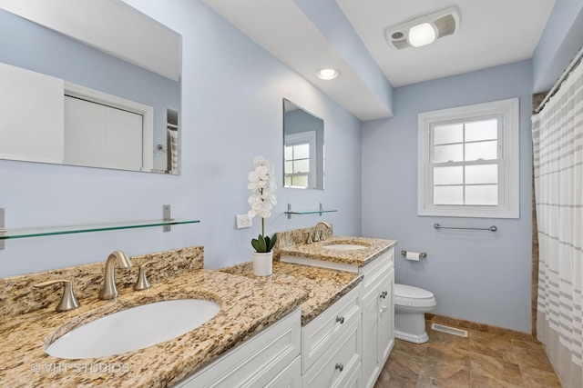 69 N Idlewild Ave, Mundelein, IL 60060 - full bathroom featuring toilet, double vanity, baseboards, and a shower with shower curtain