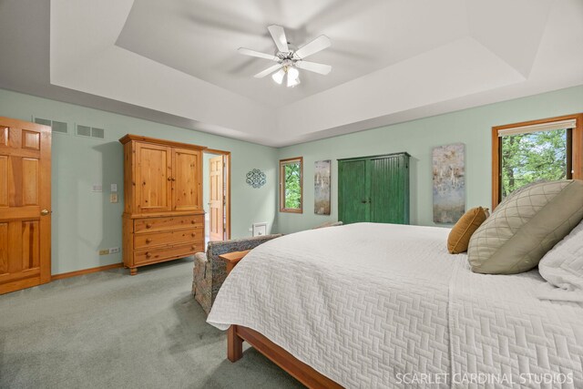 645 Rosewood Dr, West Chicago, IL 60185 - bathroom with vaulted ceiling, tile patterned floors, double vanity, a skylight, and baseboards